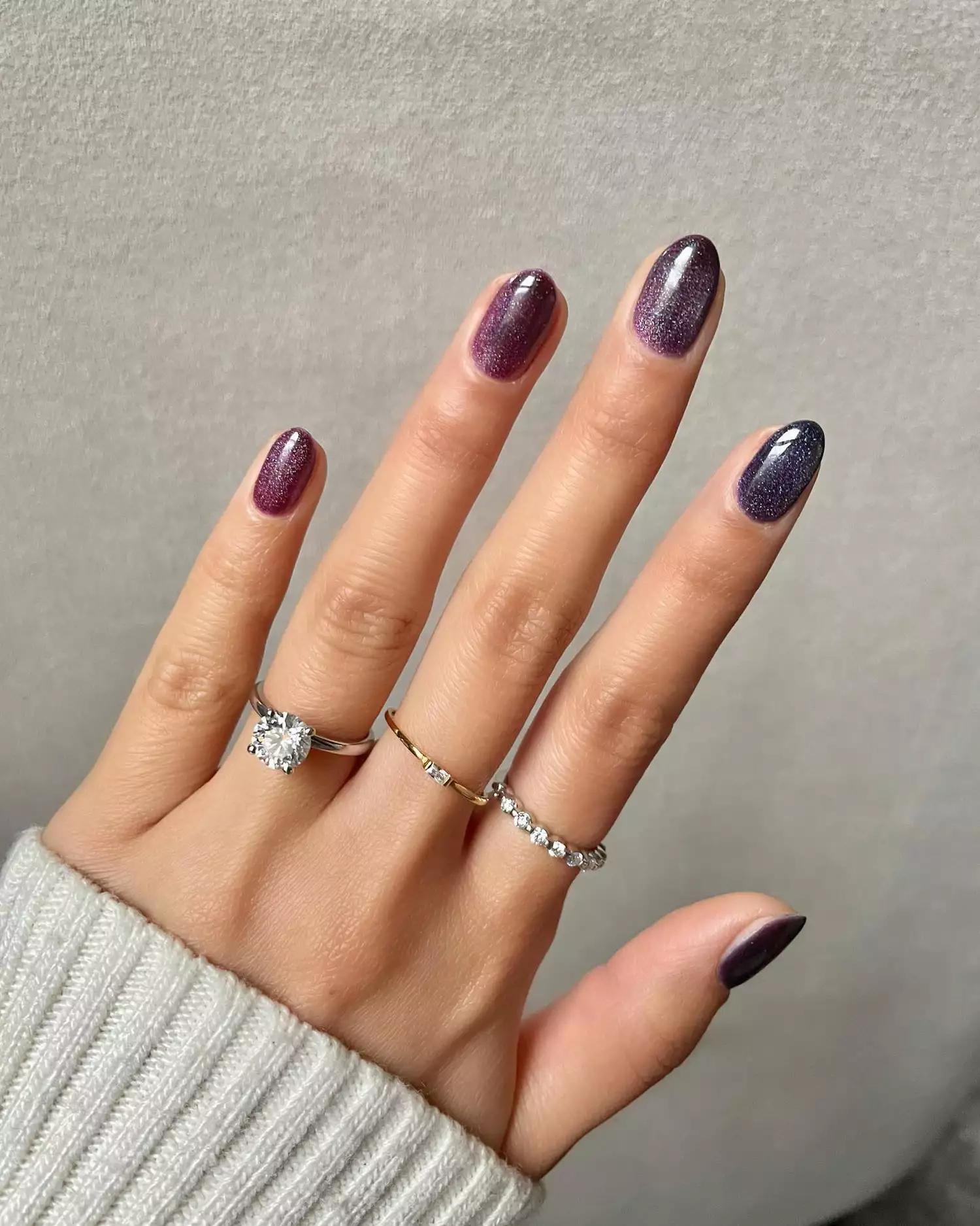 Velvet manicure in shades of deep and dark purple