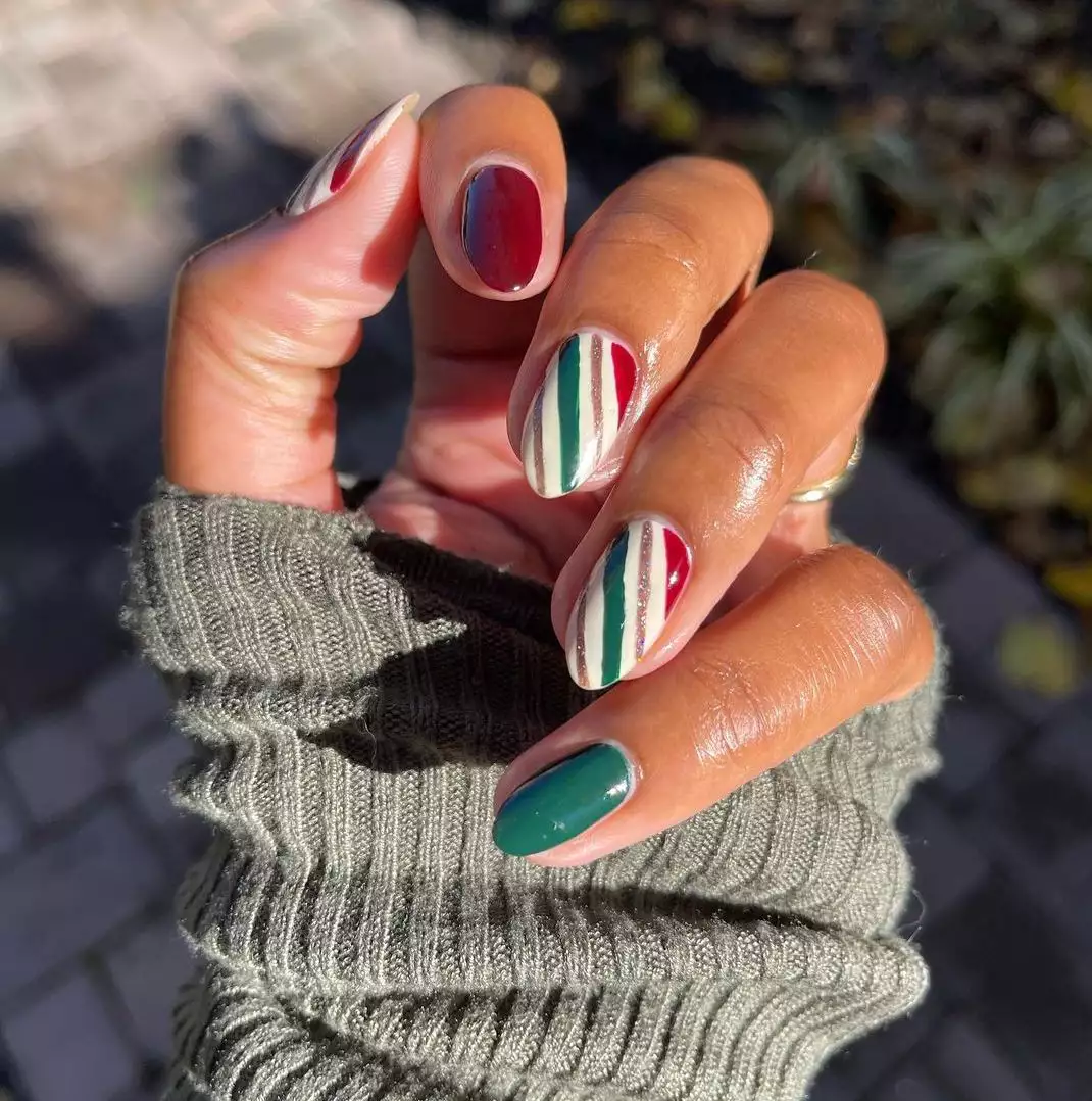 burgundy, green, and white stripe nails