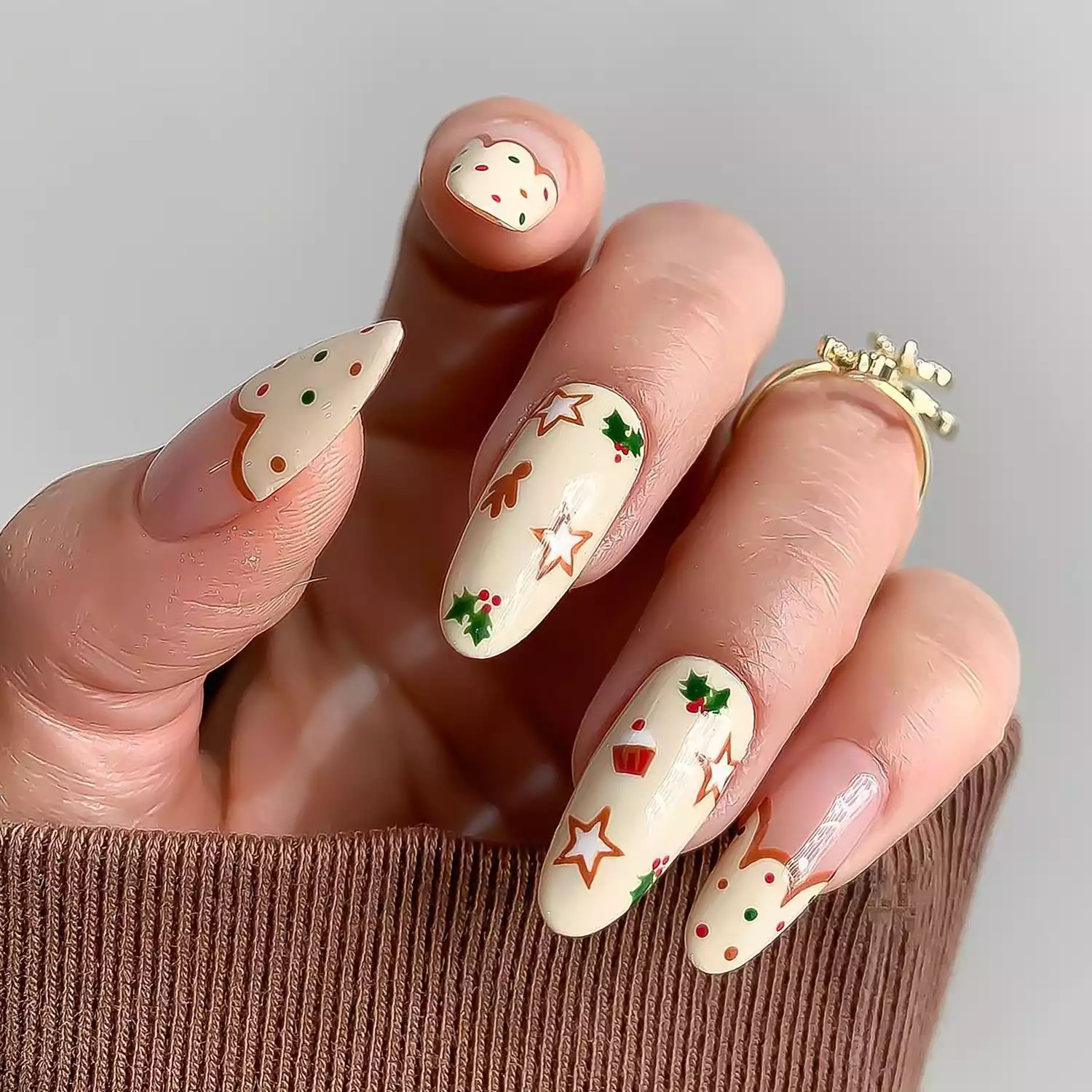 Close up of a manicure in eggnog white with holiday details