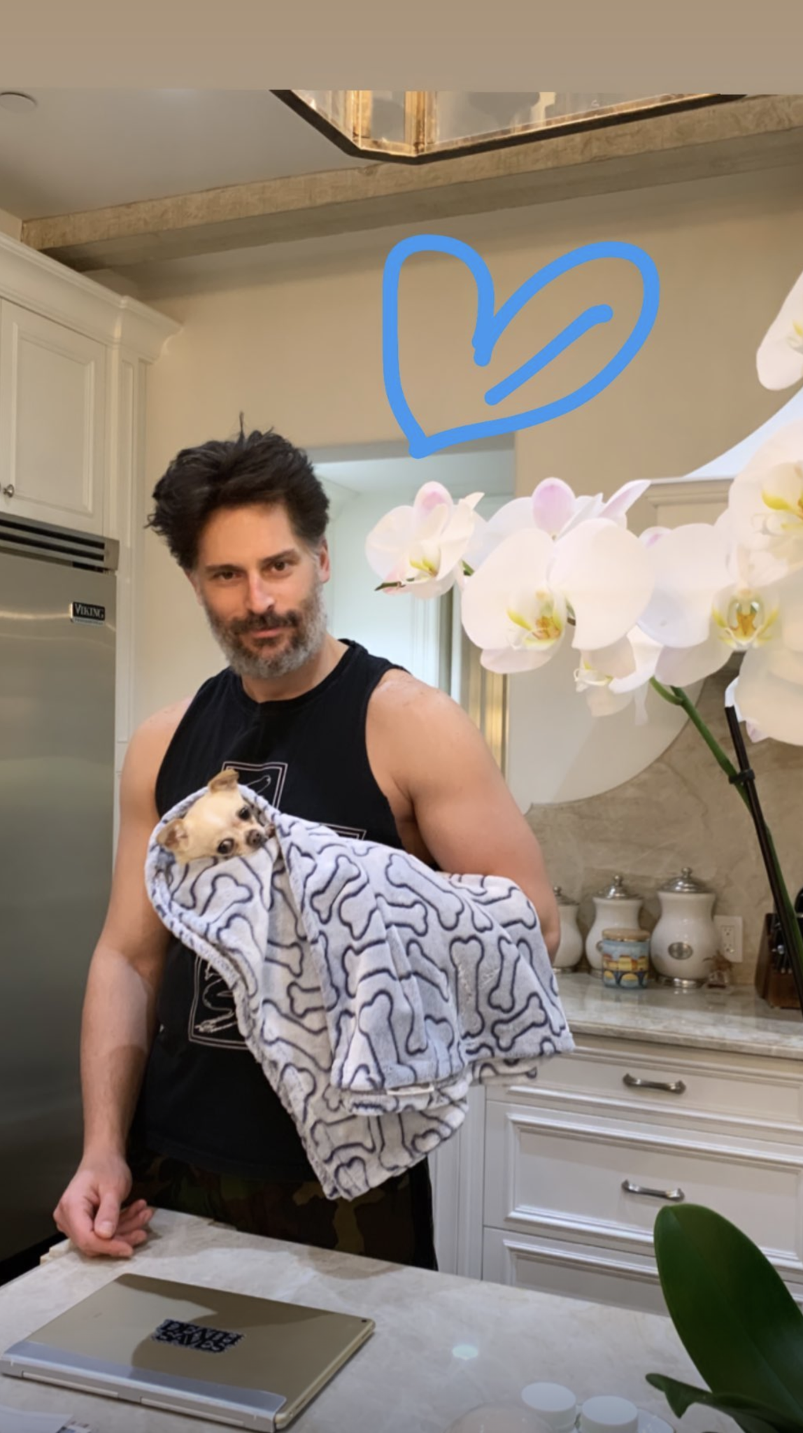 Sofia Vergara snaps an adorable photo of hubby Joe Manganiello snuggling their doggy niece Baguette. Baguette the dog belongs to Sofia's son Manolo Gonzalez Vergara, although she looks very comfortable in the arms of