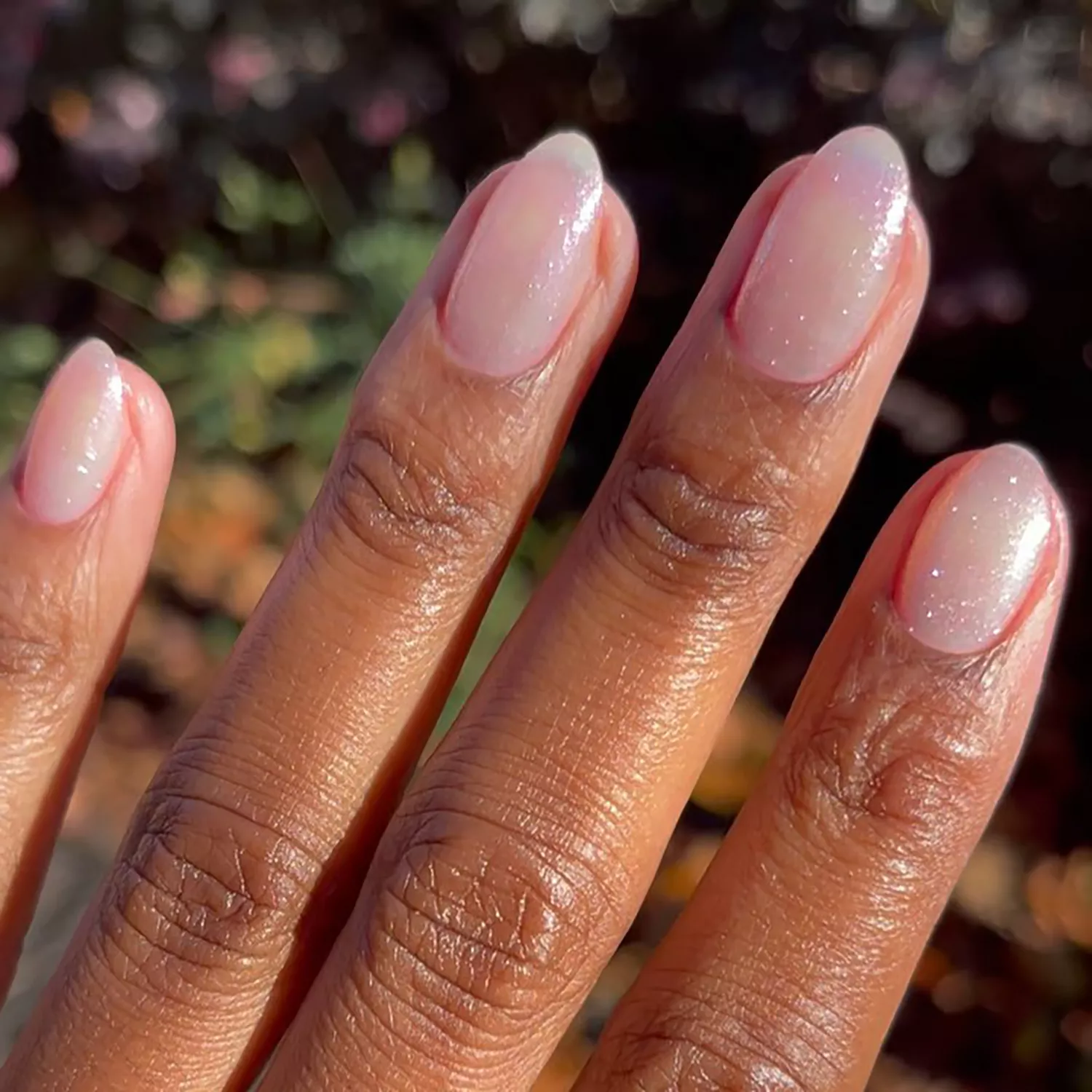 Close up of natural nails with a sparkly dusting of glittery