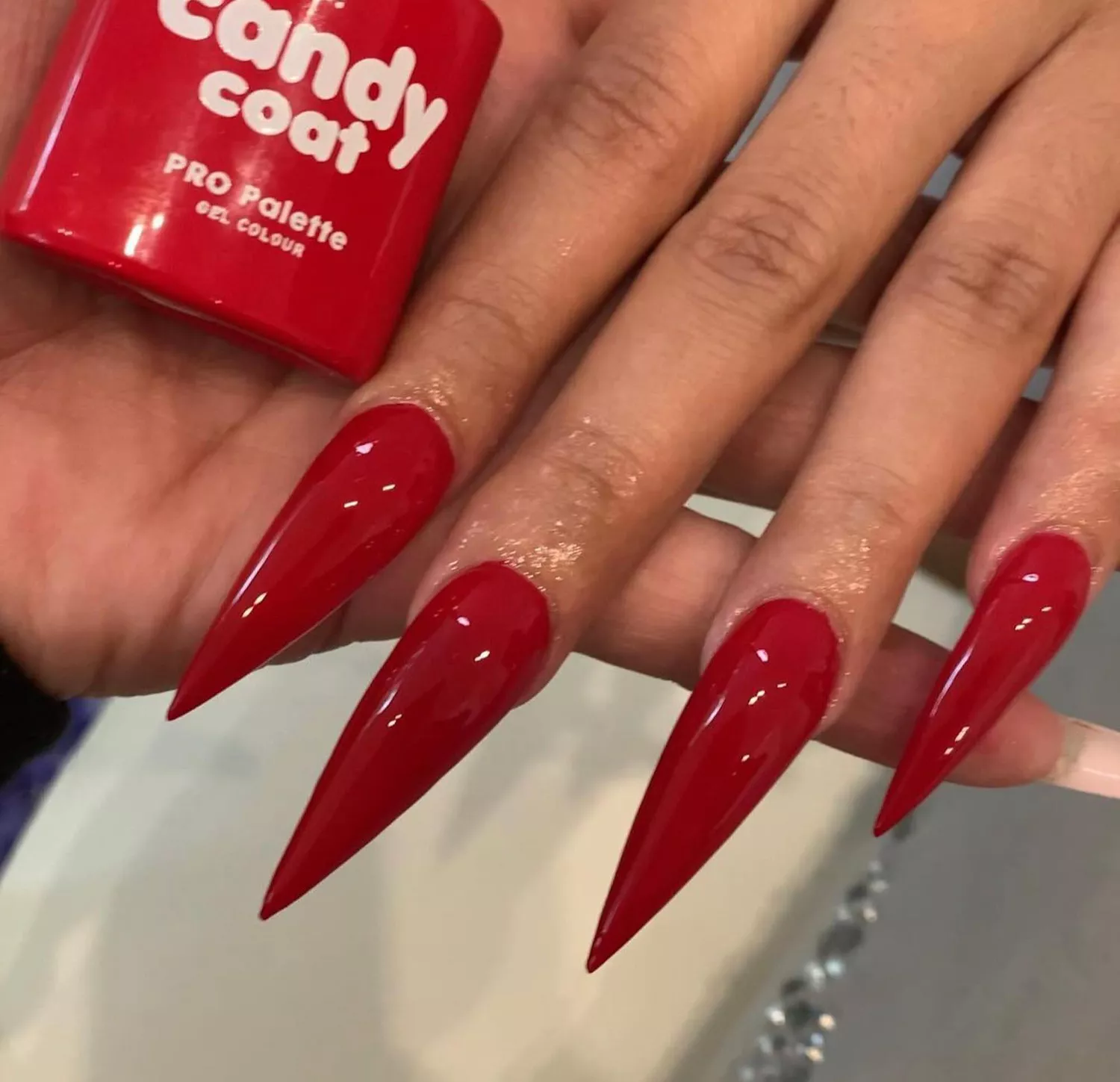 Close up of Cardi B's red nails