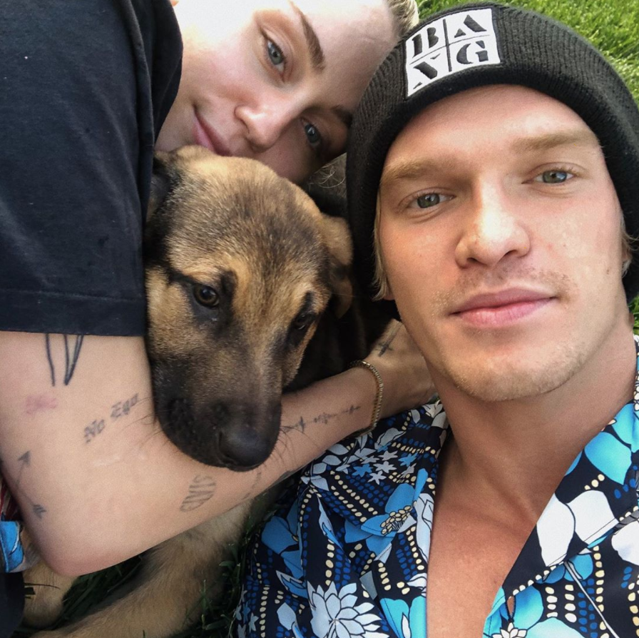 Cody Simpson snapped an adorable photo with girlfriend Miley Cyrus and her newly adopted puppy Bo Cyrus.