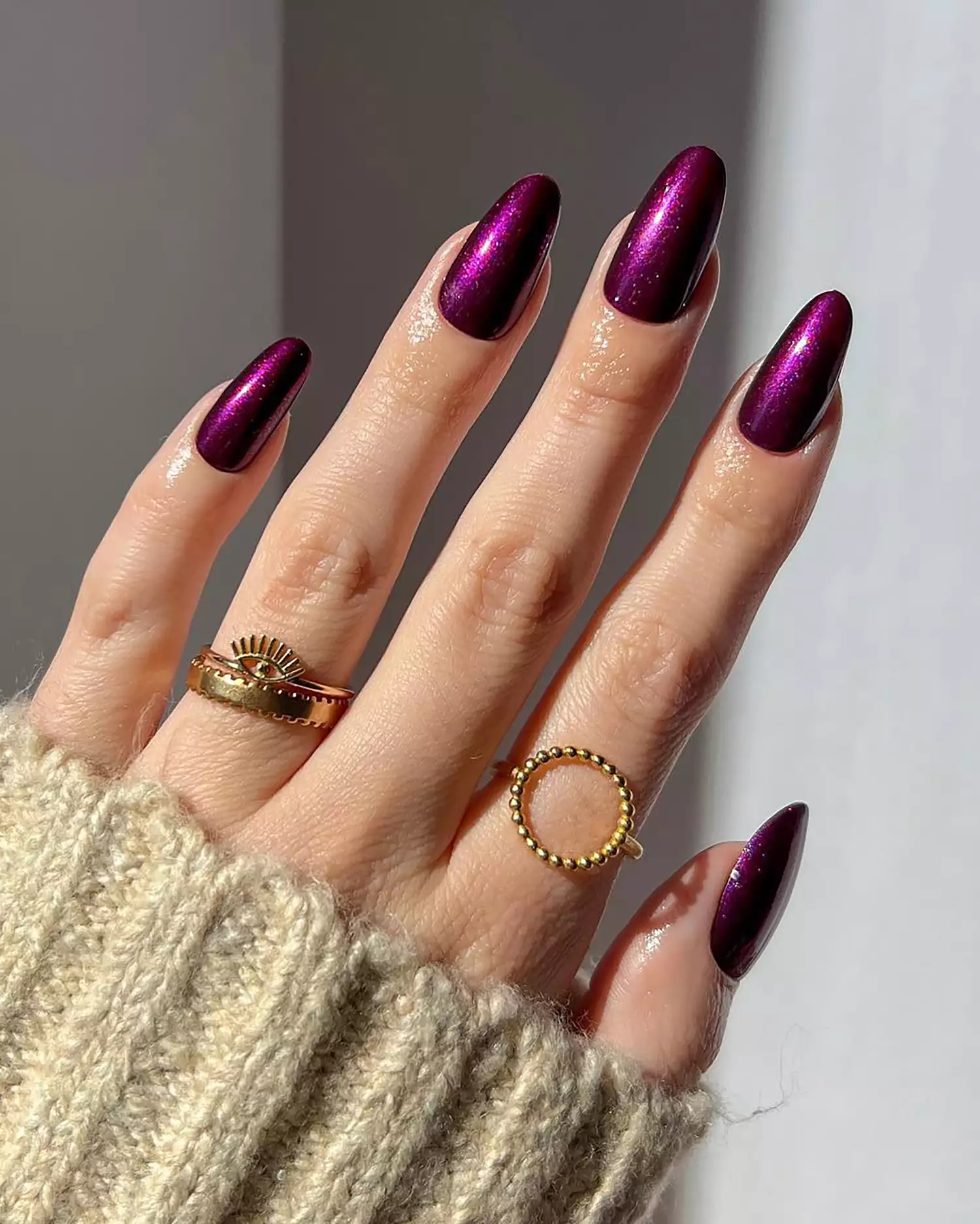 Close up of a shiny purple manicure 