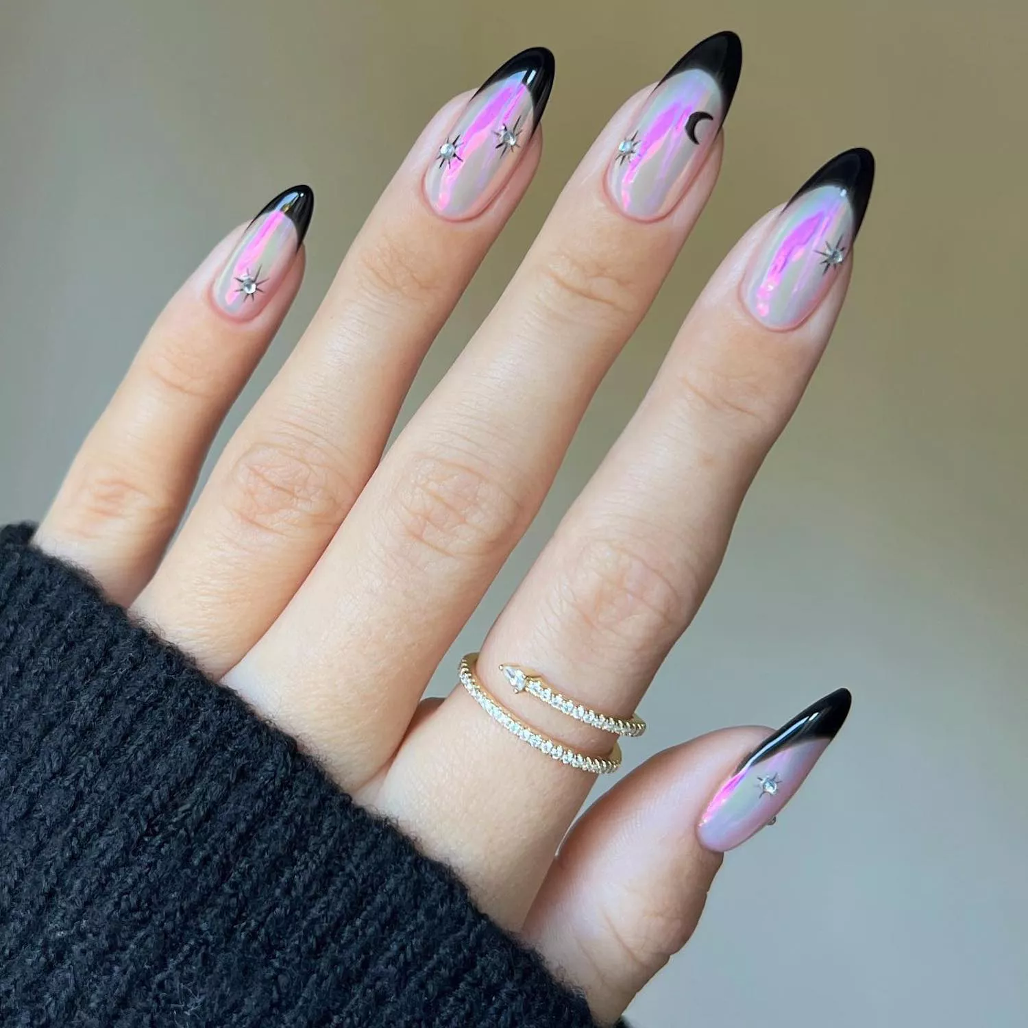 Black French manicure with iridescent chrome base and moon and star nail designs