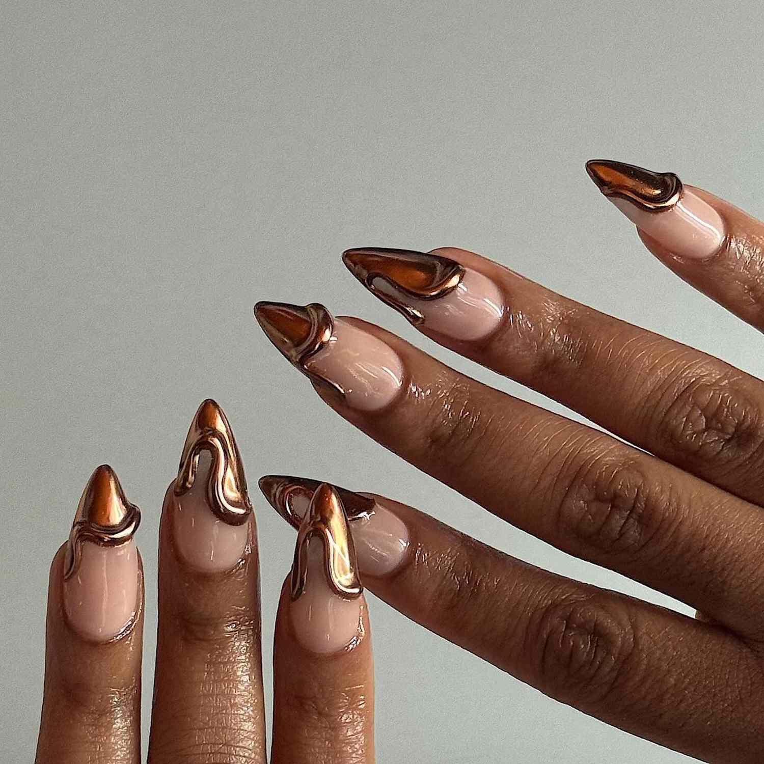 A French manicure with chocolate chrome 3D tips