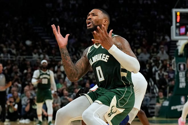 Oct. 26: New Milwaukee Bucks guard Damian Lillard reacts after being called for a foul during the third quarter against the Philadelphia 76ers.