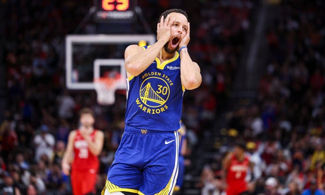 Oct. 29: Golden State Warriors guard Stephen Curry (30) reacts after making a basket during the fourth quarter against the Houston Rockets. Curry scored 24 points in the Warriors' 106-95 win.