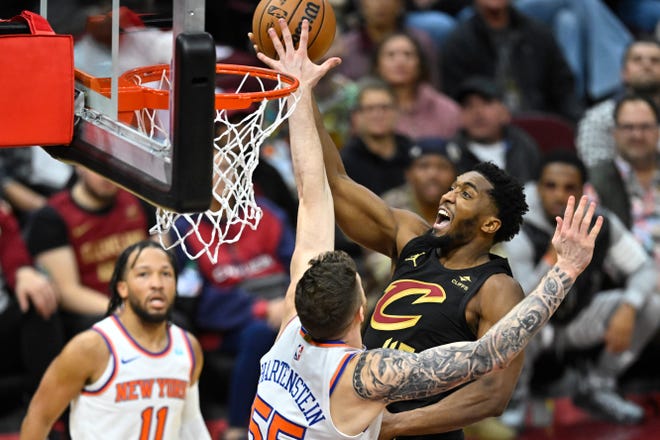 Oct. 31: Cleveland Cavaliers guard Donovan Mitchell drives to the basket against New York Knicks center Isaiah Hartenstein (55).