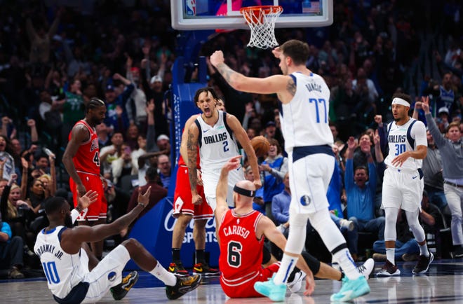 Nov. 1: Dallas Mavericks center Dereck Lively II (2) and guard Luka Doncic (77) celebrate after a play in the second half against the Chicago Bulls.