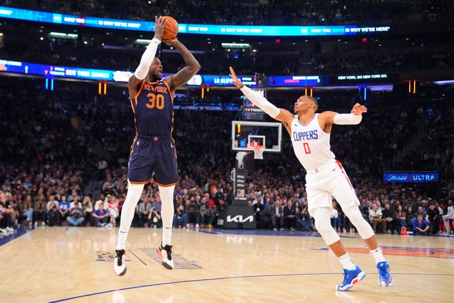 Nov. 6: New York Knicks power forward Julius Randle (30) shoots a three-point over Los Angeles Clipper guard Russell Westbrook (0) during the first quarter at Madison Square Garden. The Knicks won 111-97.