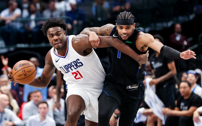 Nov. 10: LA Clippers guard Kobe Brown (21) controls the ball as Dallas Mavericks guard Jaden Hardy (1) defends during the second half at American Airlines Center.