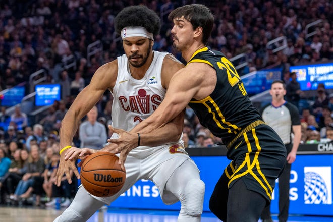 Nov. 11: Golden State Warriors forward Dario Saric defends Cleveland Cavaliers center Jarrett Allen during the first quarter at Chase Center.