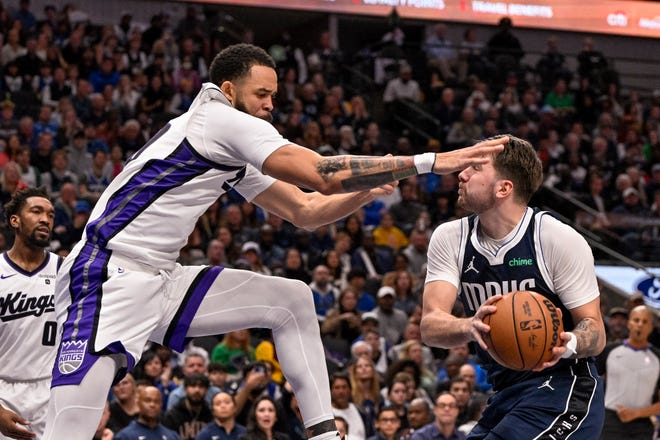 Nov. 19: The Dallas Mavericks' Luka Doncic (77) is fouled by the Sacramento Kings' JaVale McGee (00) during the second quarter at the American Airlines Center.