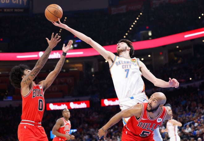 Nov. 22: Oklahoma City's Chet Holmgren (7) reaches for a loose ball against the Chicago Bulls.