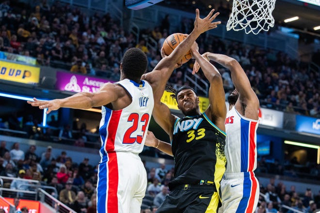 Nov. 24: Indiana Pacers center Myles Turner (33) shoots the ball while Detroit Pistons guard Jaden Ivey (23) and center Isaiah Stewart (28) defend.