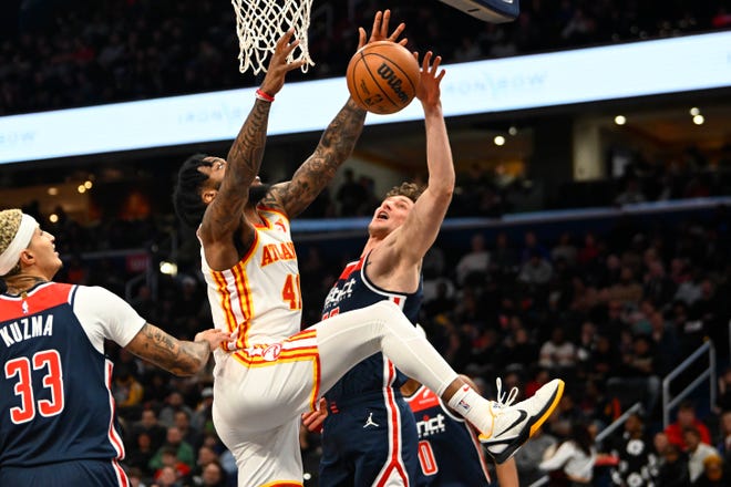 Nov. 25: Washington Wizards center Mike Muscala blocks the shot by Atlanta Hawks forward Saddiq Bey (41) during the first half at Capital One Arena.