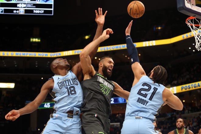 Nov. 26: The Memphis Grizzlies' Bismack Biyombo (18) and David Roddy (21) battle for a rebound with the Minnesota Timberwolves' Rudy Gobert during the first half at FedExForum.