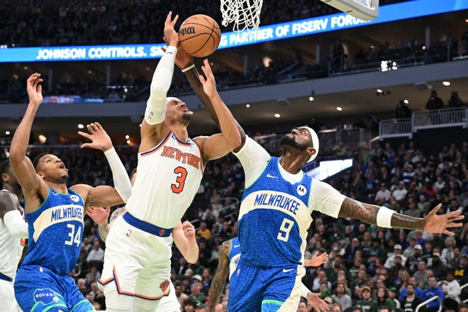 Dec. 5: New York Knicks guard Josh Hart (3) and Milwaukee Bucks forward Bobby Portis (9) battle for a rebound in the first half at Fiserv Forum.