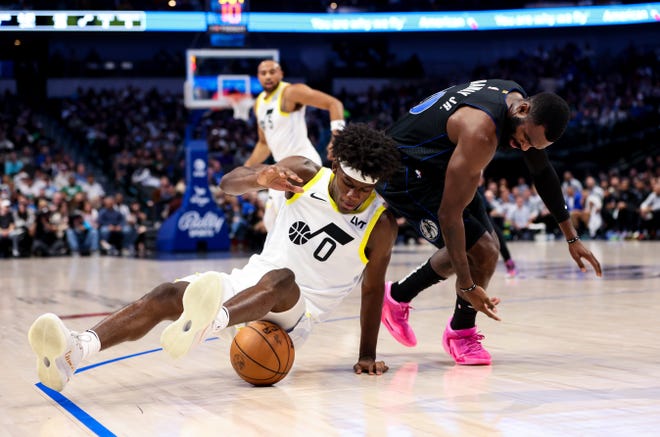 Dec. 6: Utah Jazz forward Taylor Hendricks (0) and Dallas Mavericks forward Tim Hardaway Jr. (10) go for a loose ball during the second quarter at American Airlines Center.