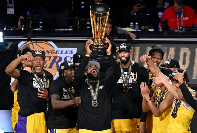 Dec. 9: LeBron James hoists the NBA Cup after the Lakers defeated the Pacers to win the NBA In-Season Tournament.