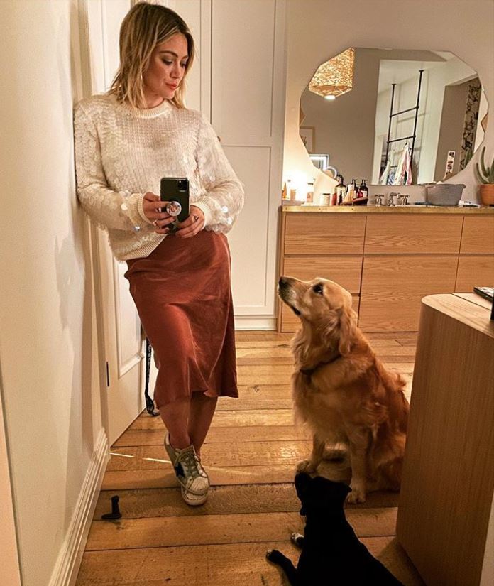 Looks like Hilary Duff's got the fuzziest fans: the actress snapped a mirror selfie on Dec. 6, 2019 with her two dogs Momo (black dog) and Lucy and captioned it