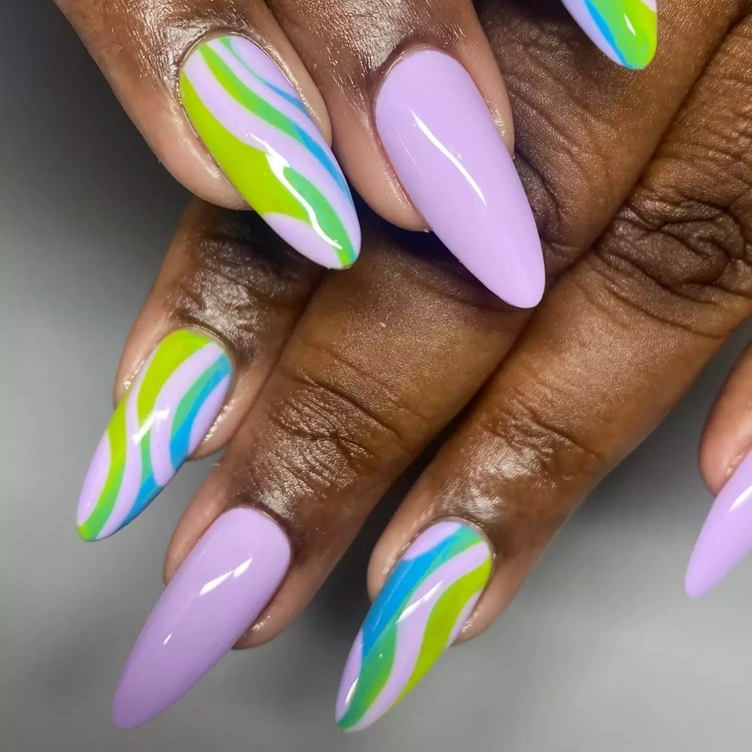 Cool Ombre Swirl Nails in shades of lavender, green, and blue