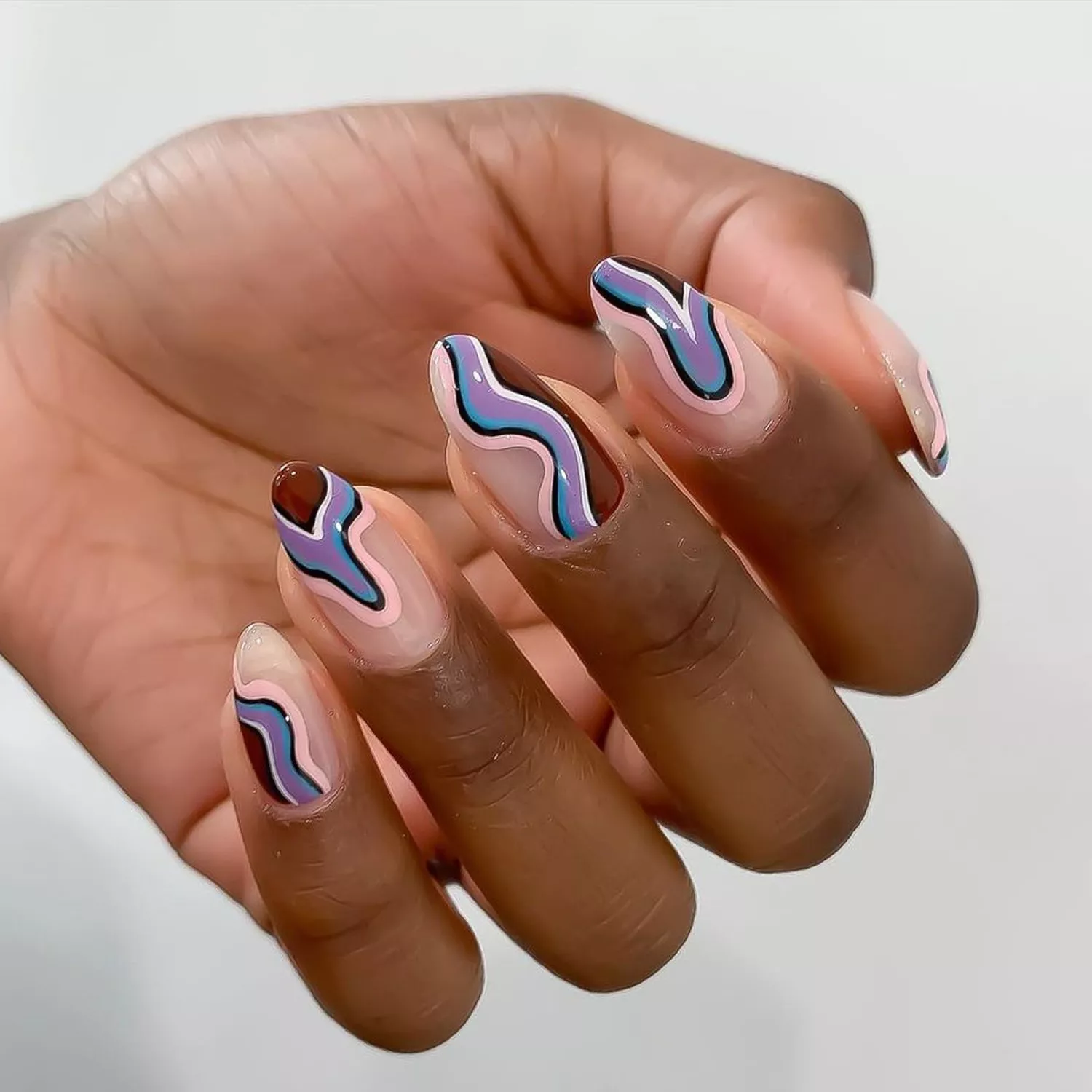 Cool-Toned Swirl Nails against a white background