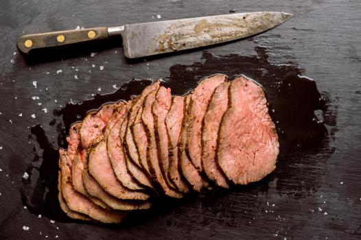 A recipe for prune, peppercorn and fresh herb-rubbed roast beef.