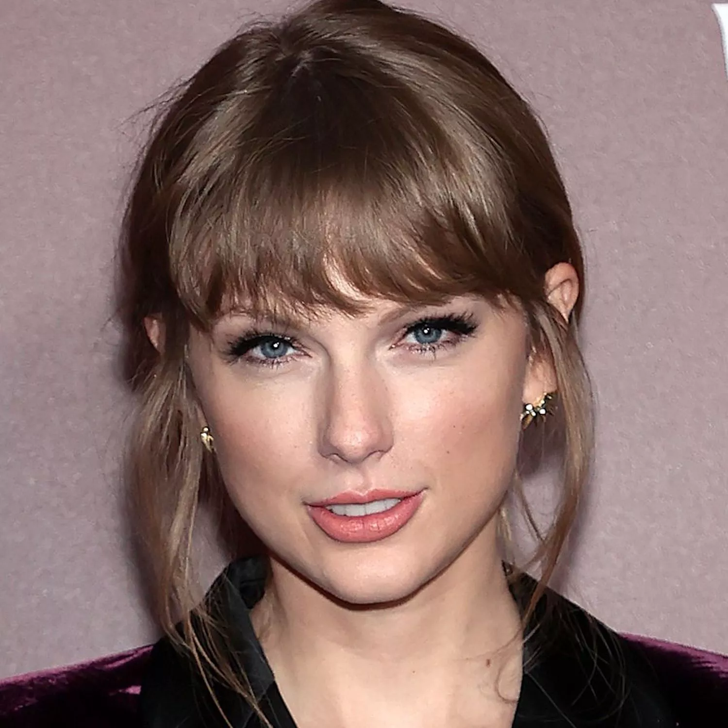 Taylor Swift wears a low bun with face-framing pieces to the 2021 premiere of the "All Too Well" short film