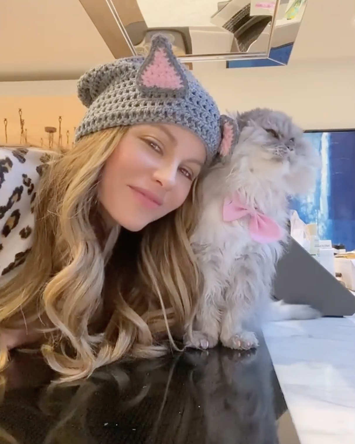 Kate Beckinsale takes cat lady to another level with homemade cat ears to match her cat Clive with a silly video on Tuesday, May 4, 2021.