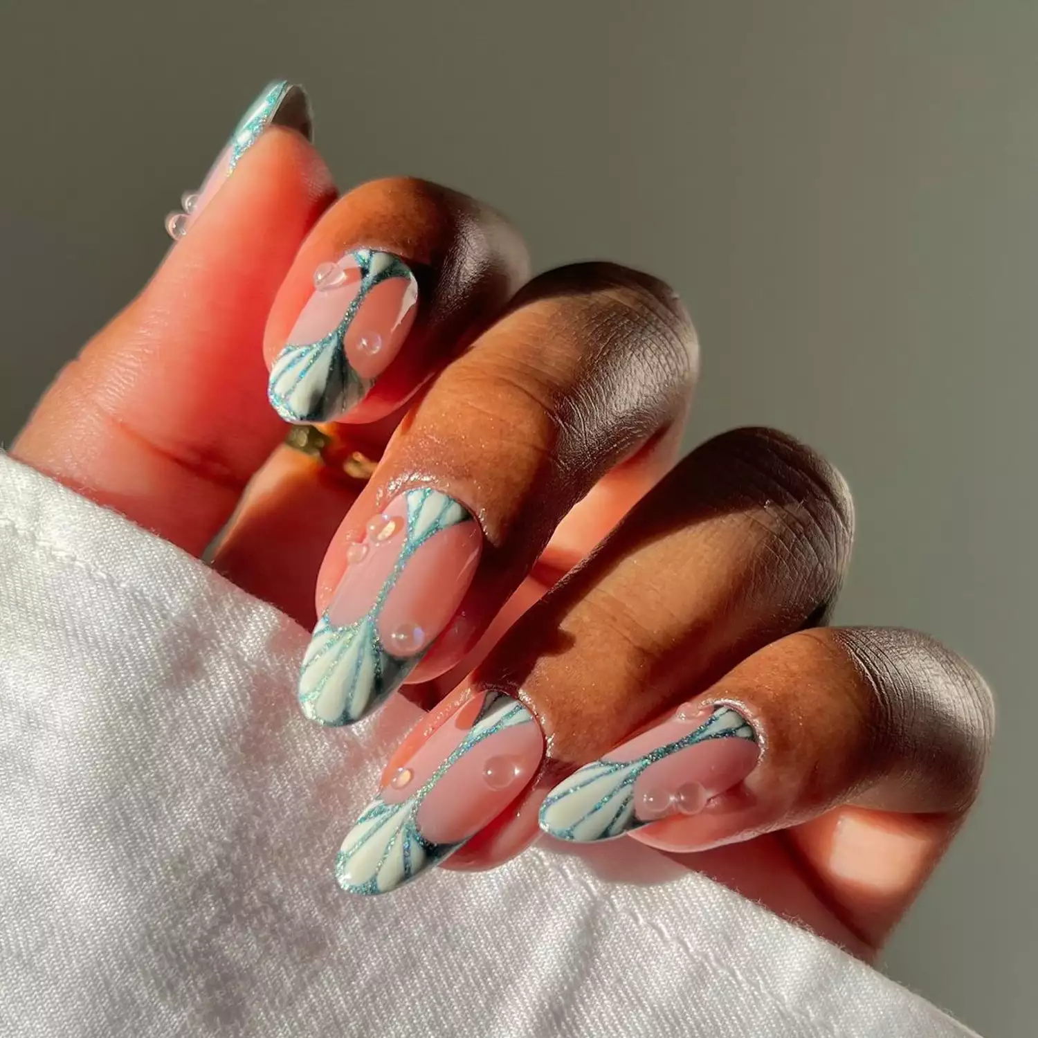 A manicure with a mermaid-inspired design