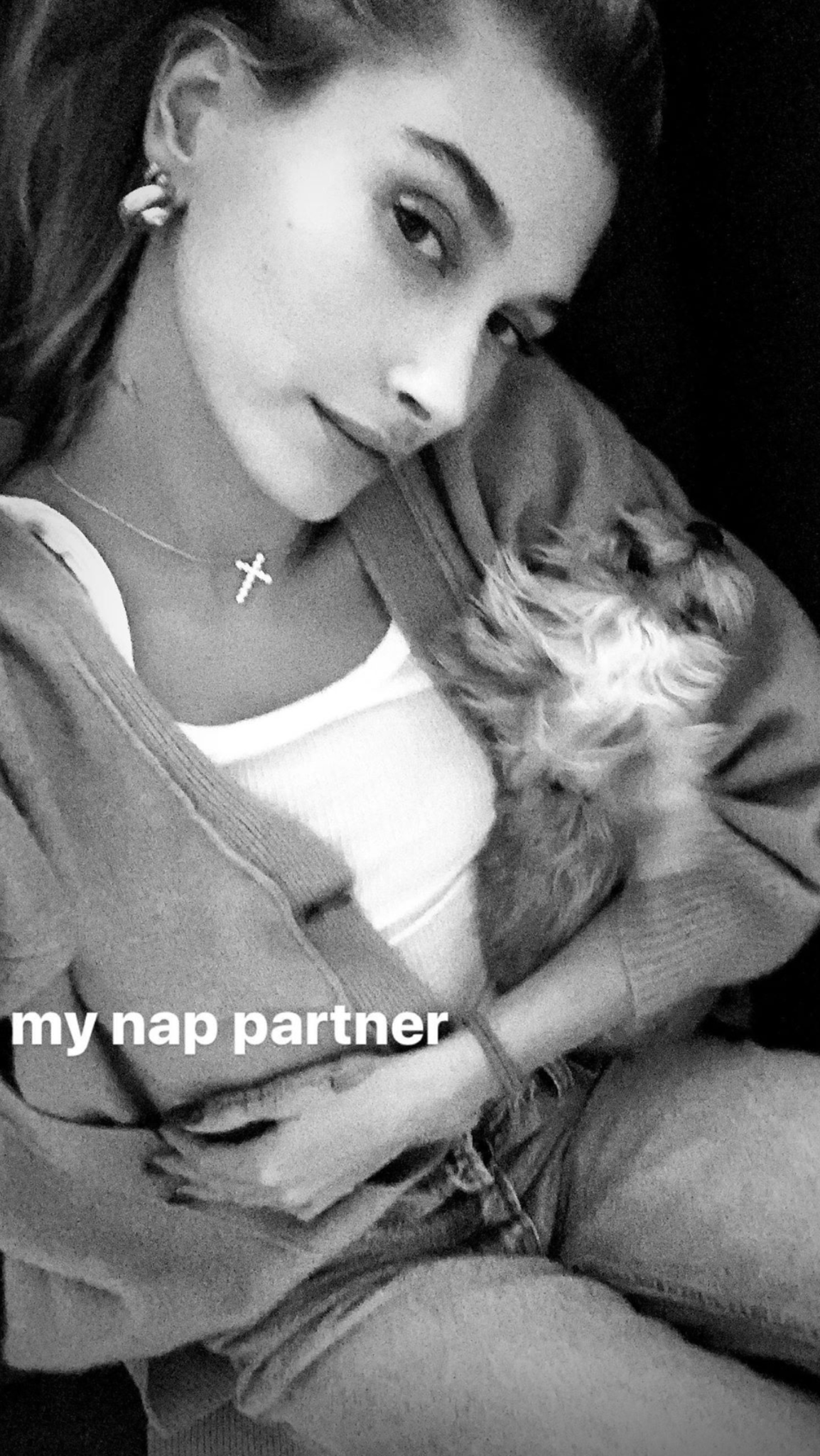 Hailey Bieber cuddles up with her