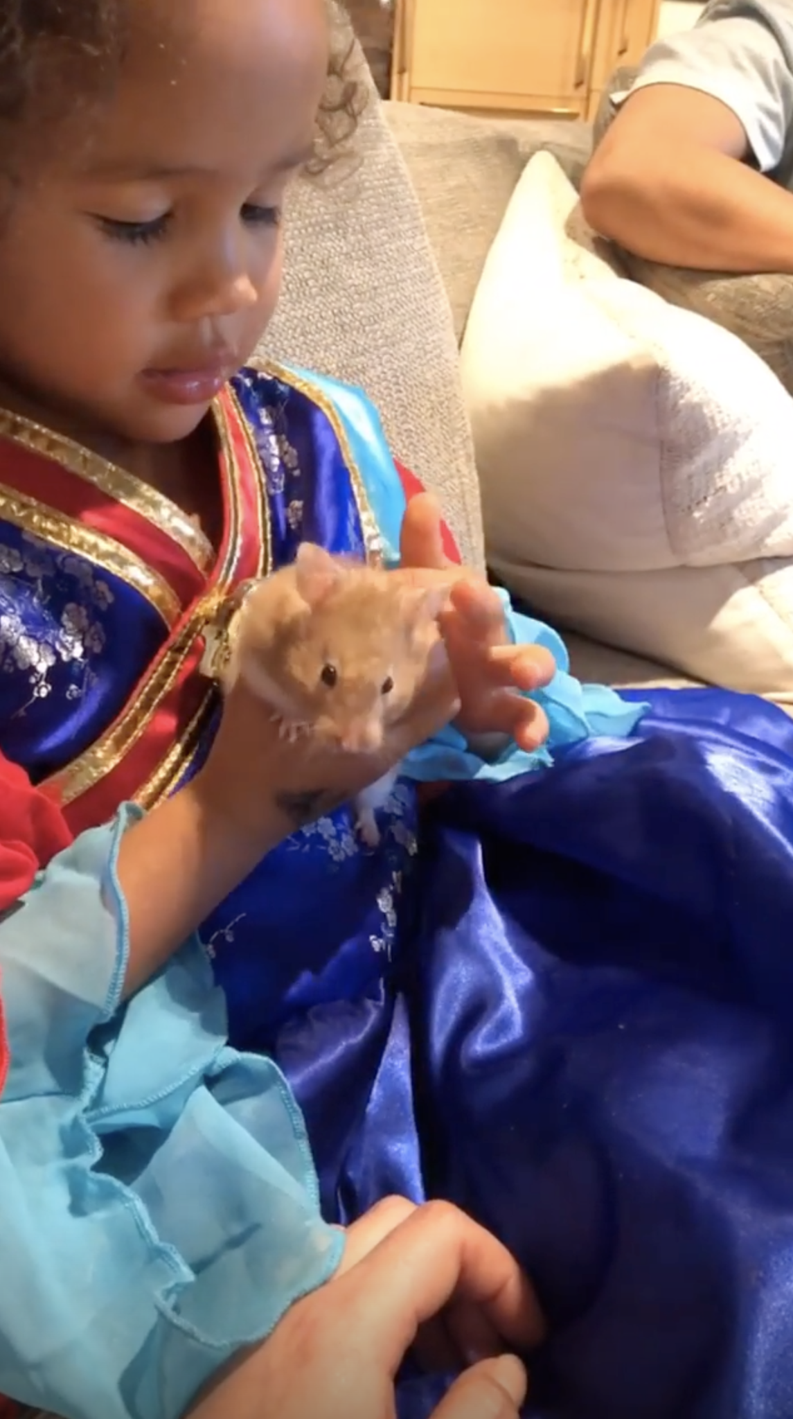 Chrissy Teigen and John Legend's daughter, Luna, enjoys some hands-on time with her pet hamster, Peanut Butter.