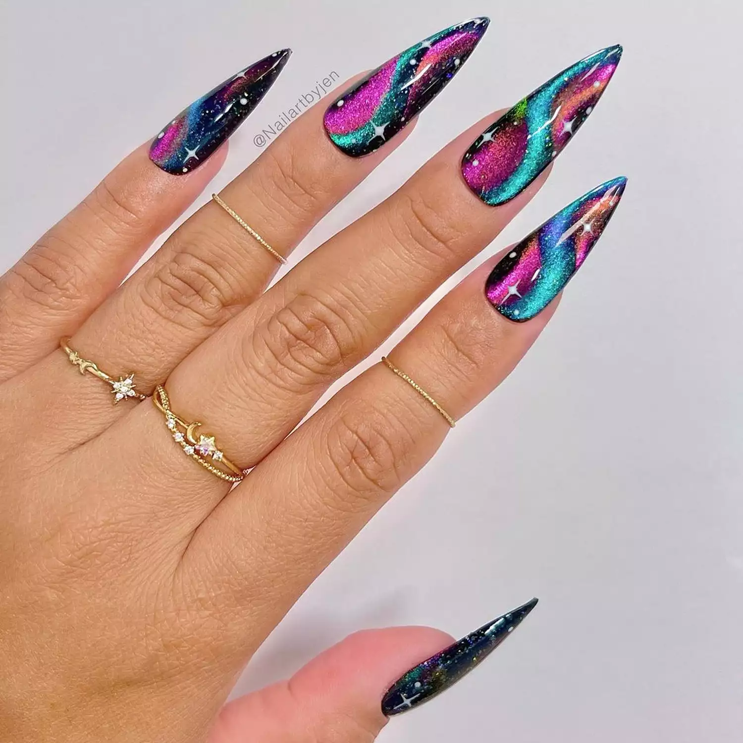 Velvet Multicolor Swirl Nails in shades of magenta, blue, and black