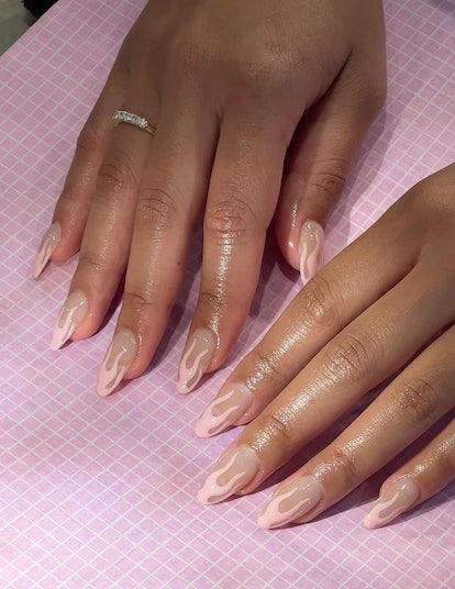 Peach flame nail art is an on-trend peach fuzz nail design for 2023.