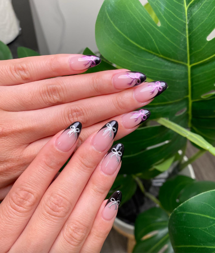 black french tip new years nails with cute pink and silver metallic bow nail art