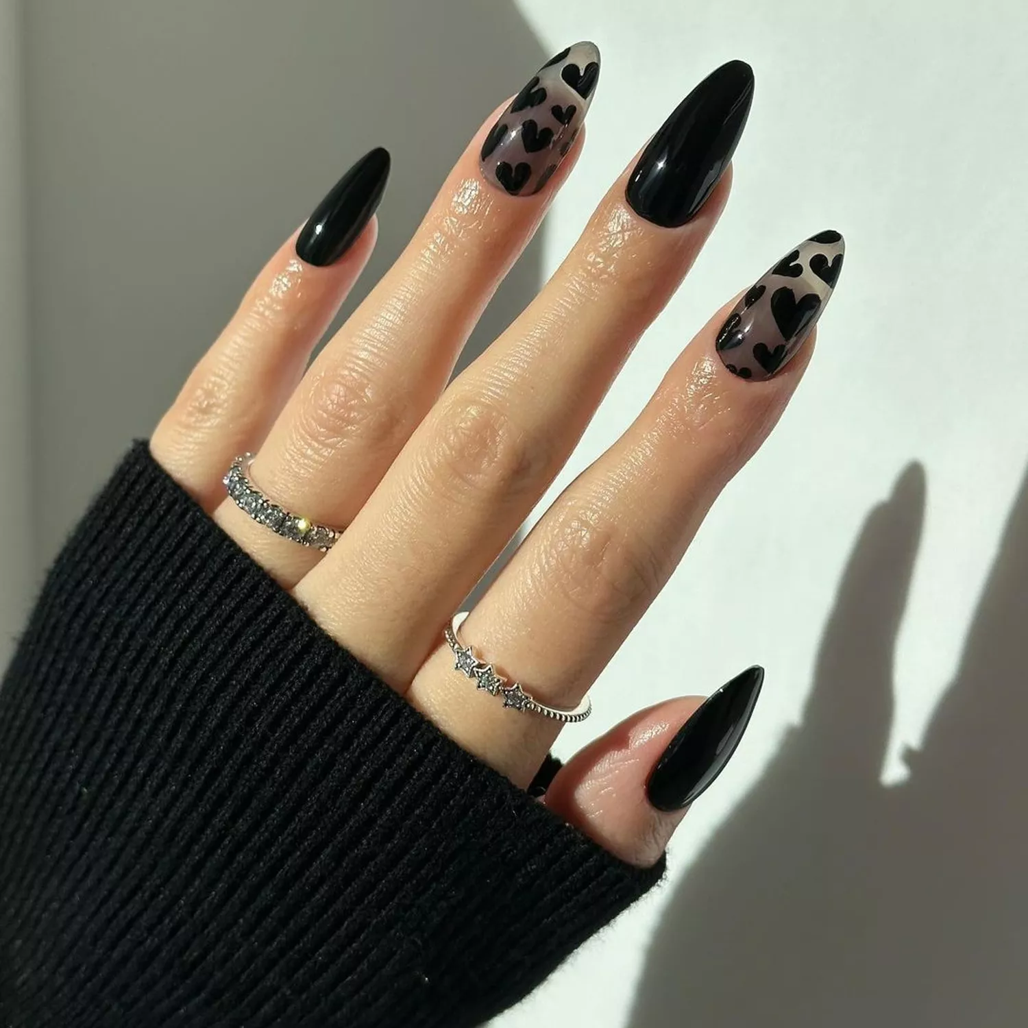 translucent black nails with black hearts