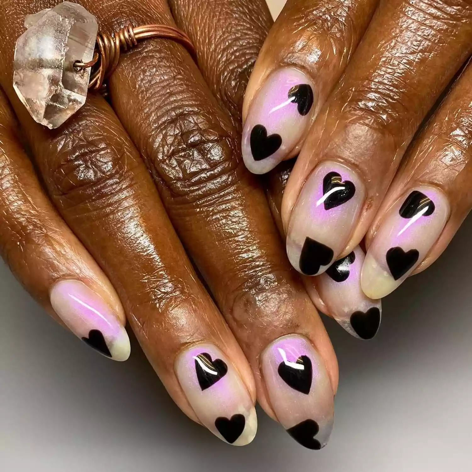 clear nails with pink and black hearts