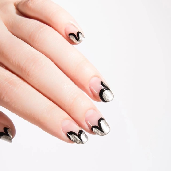 black and silver Art Deco inspired wedding manicure with a graphic swoosh design