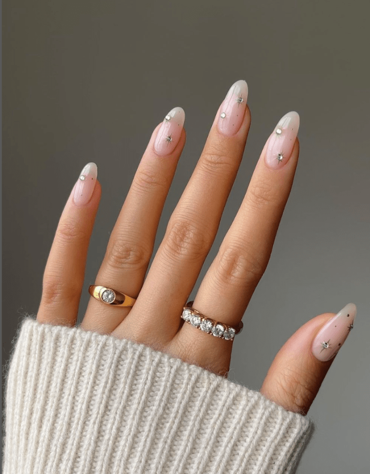 classy celestial inspired simple wedding nails with rhinestone star design details