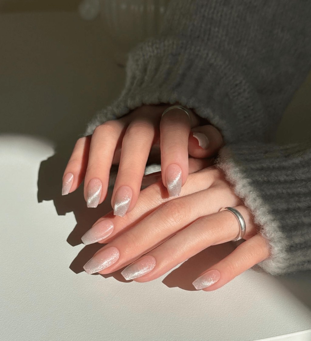 bride wearing classy coffin ombre wedding nails with silver glitter polish