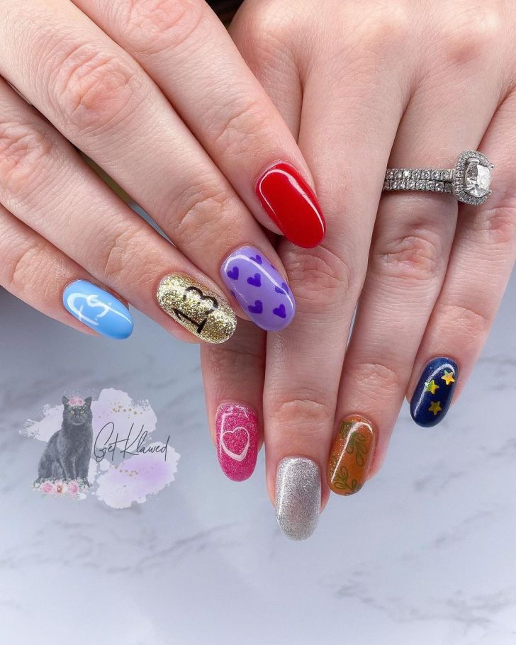 mismatched Taylor Swift nails with glittery colorful designs and album-specific illustrations inspired by each album on the Eras Tour