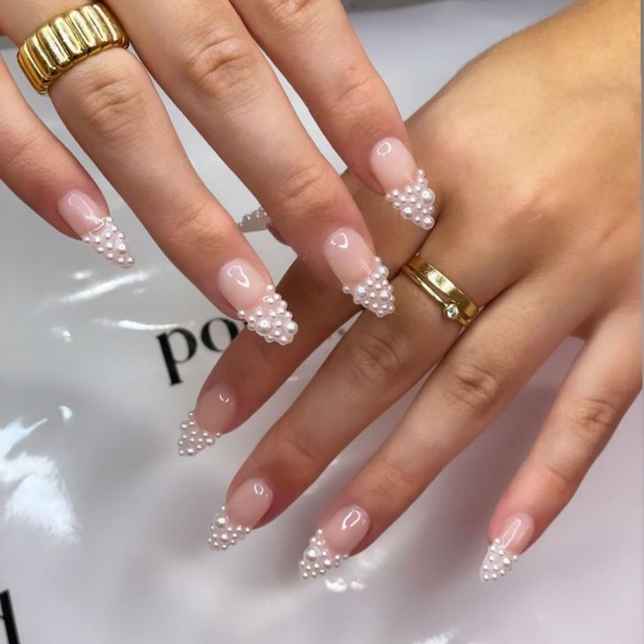 cute french manicure with 3D pearl designs on the tips