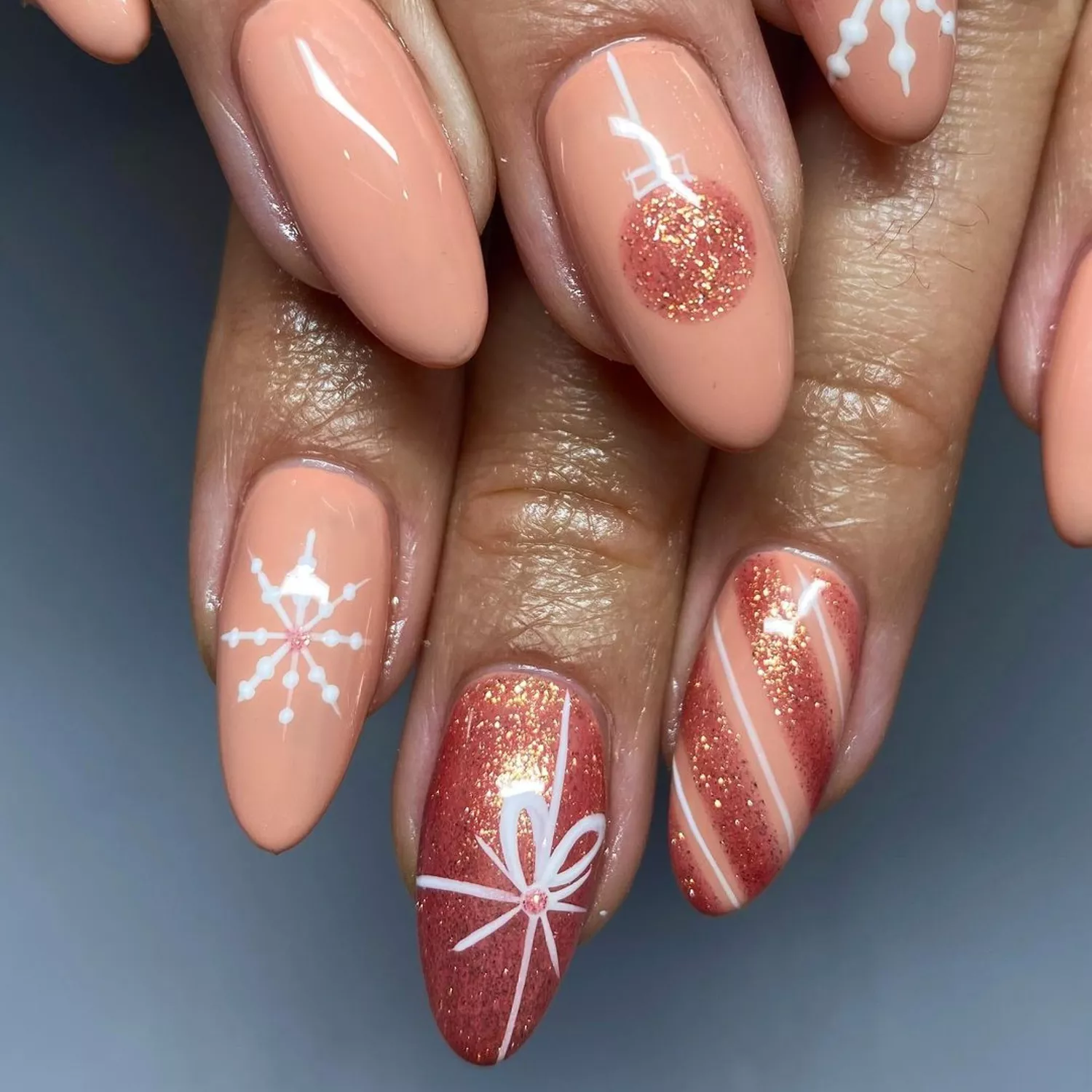 Neutral Pink and Peach Snowflake Nails - Byrdie December Nails 