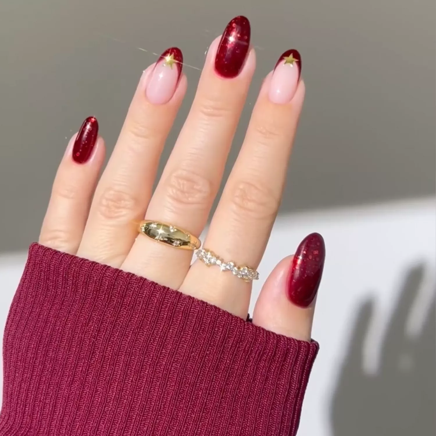 burgundy shimmer nails with star nail stickers