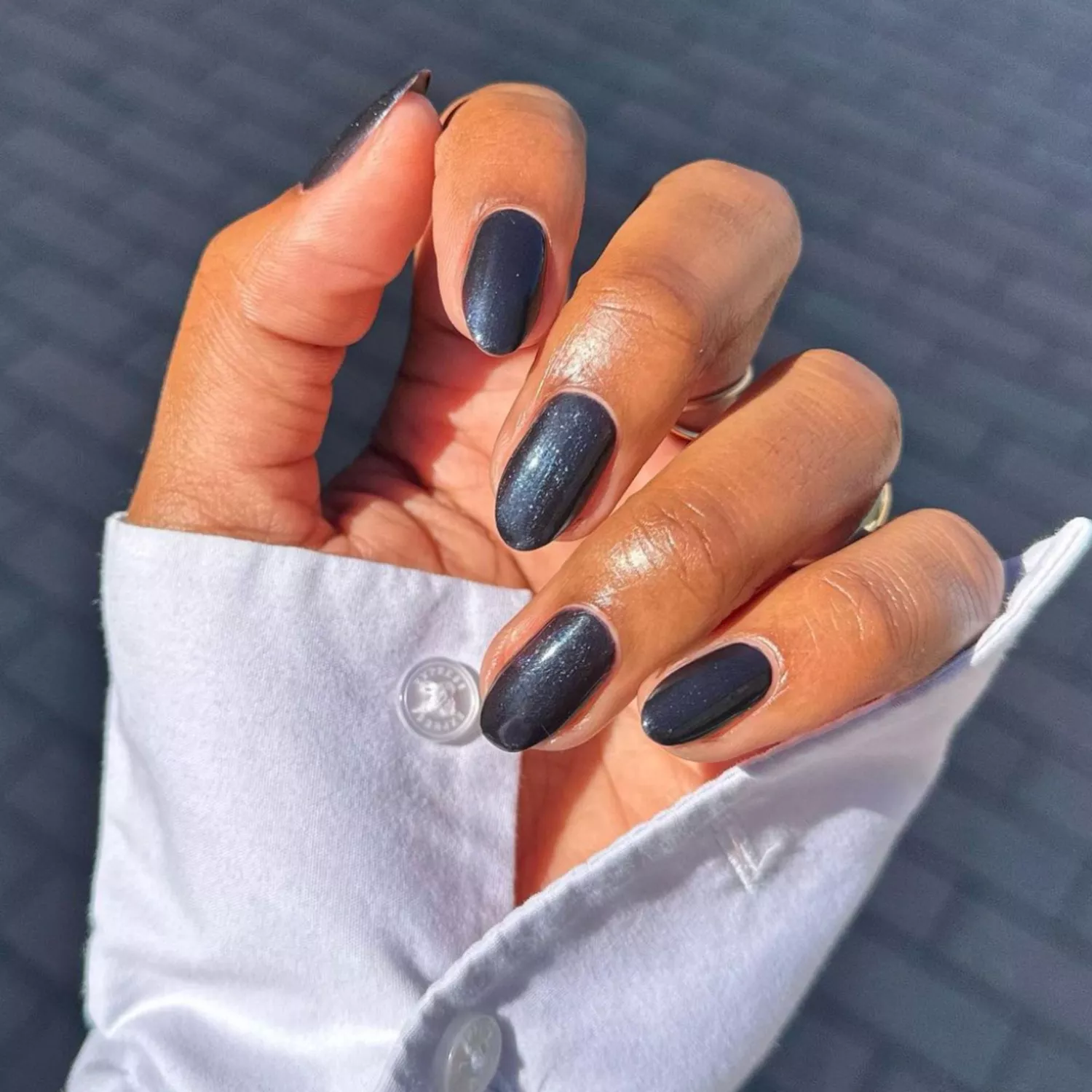 Multidimensional black manicure with a shimmery finish