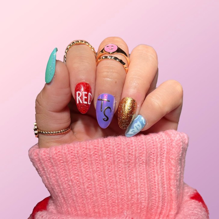 Taylor Swift Eras tour press on nails with mismatched glittery designs for every album