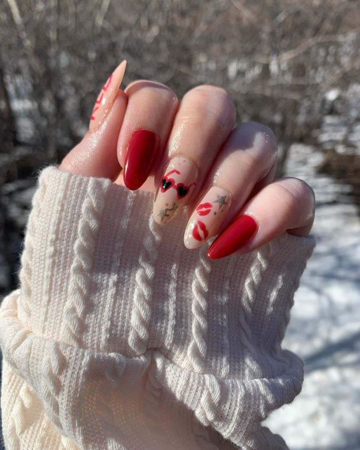 mismatched Taylor Swift nails with heart sunglasses and kisses inspired by the Red album at the Eras Tour