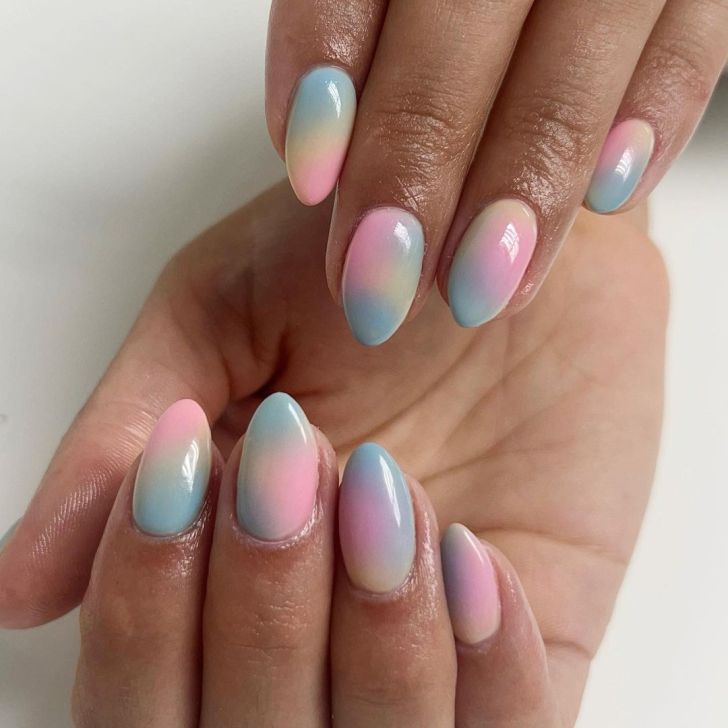 Taylor Swift nails with a pastel rainbow ombre design inspired by the Lover album on the Eras Tour